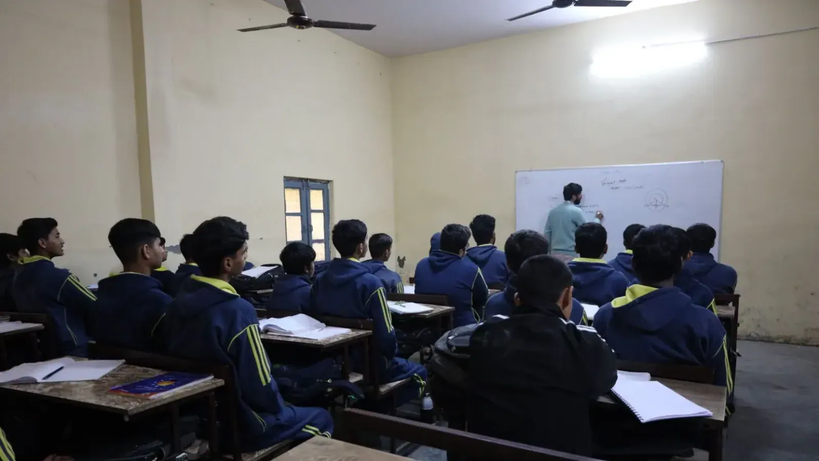 A teacher taking a class at the board