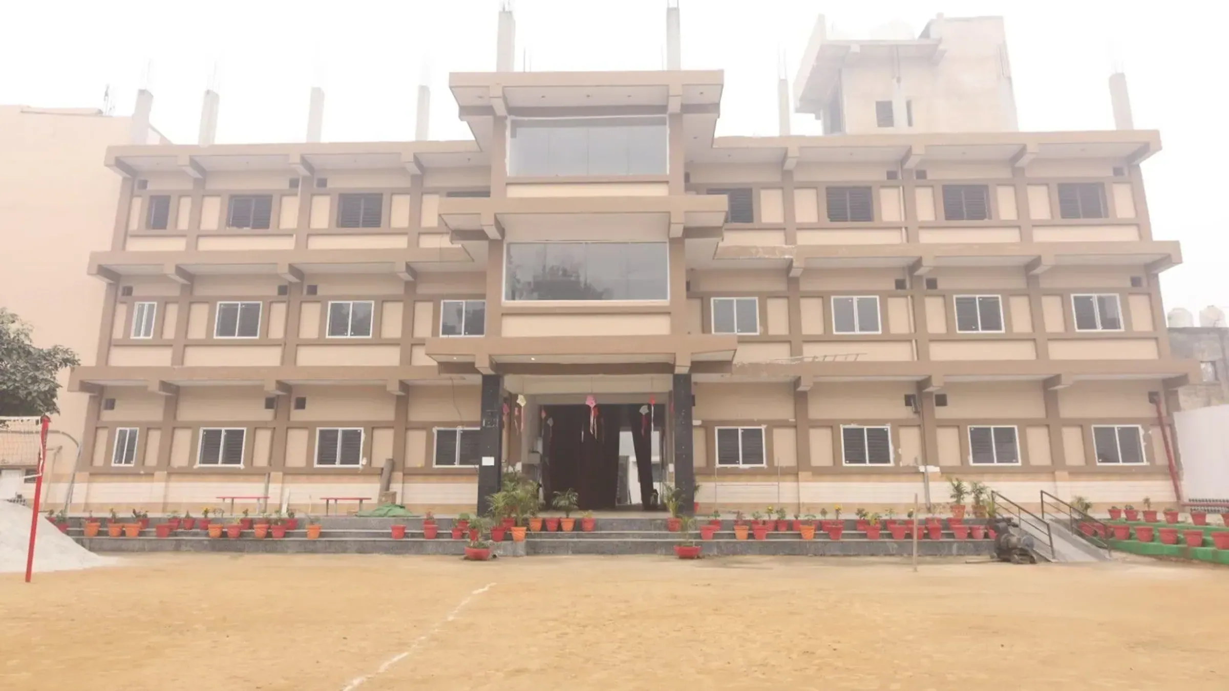 Front view of the SRS Public School building and courtyard
